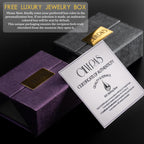 a purple jewelry box with a gold label, and a white certificate of authenticity with text.