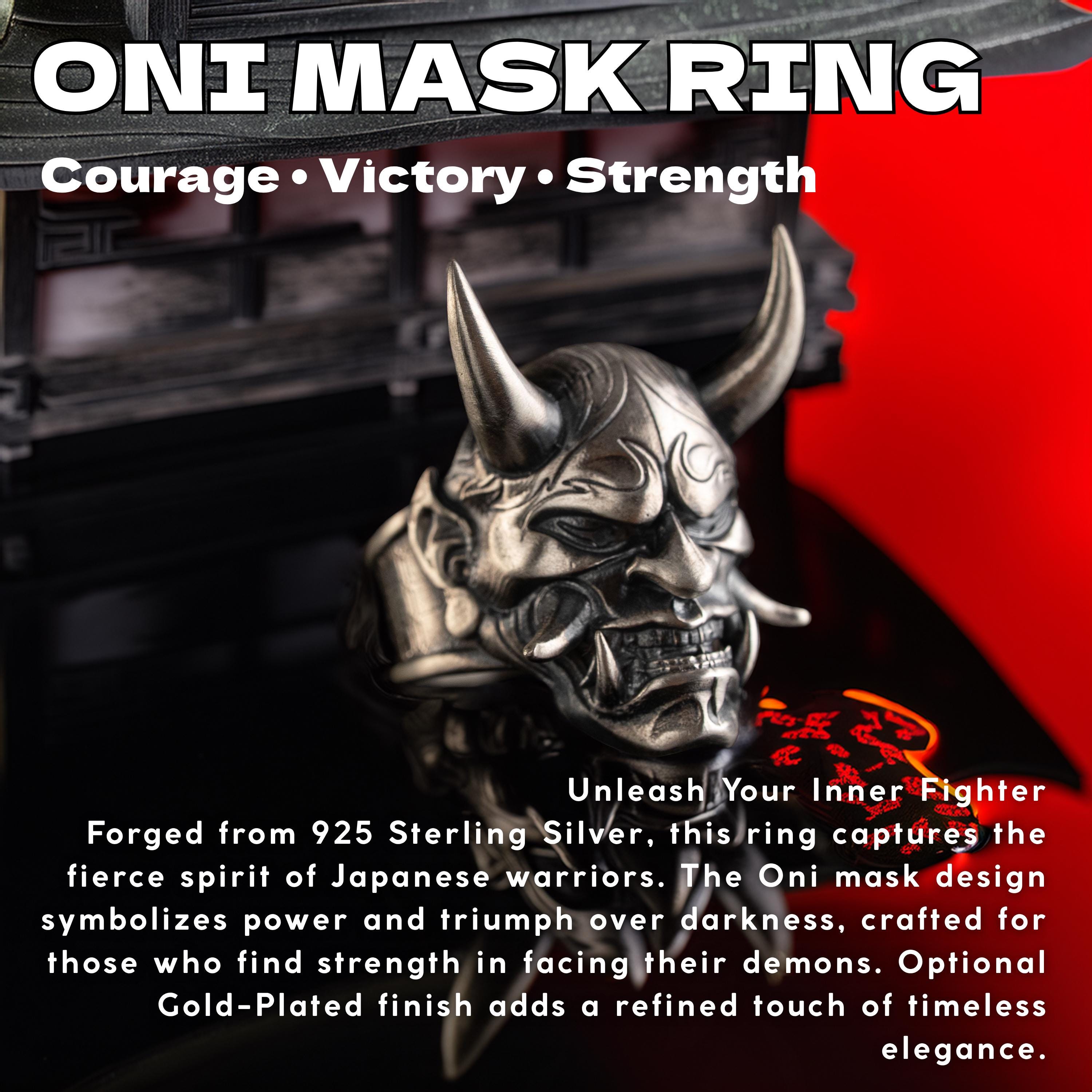 a silver Oni mask ring with a dragon-like design, set against a red background. The text above the image reads "ONI MASK RING Courage Victory Strength".
