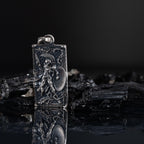 Spartan Warrior Pendant in 925 Sterling Silver, intricately designed with a warrior holding a shield, set against a dark background with reflective surface.